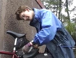 John loads his bike outside Glen Nevis youth hostel